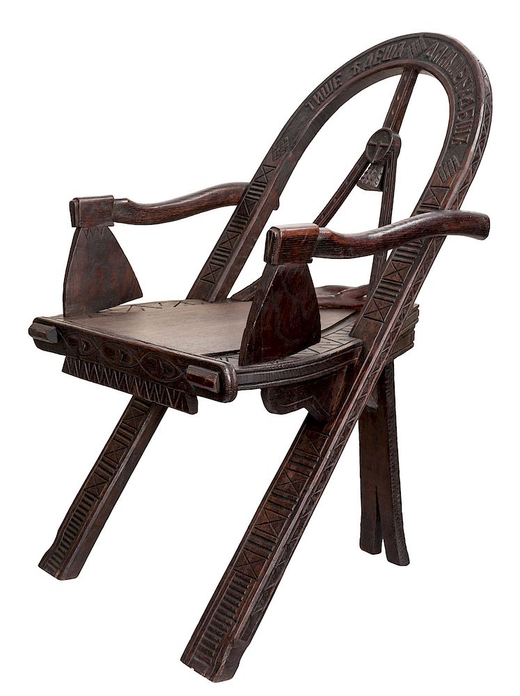 Appraisal: A RUSSIAN CARVED OAK CHAIR AFTER THE DESIGN BY VASILI