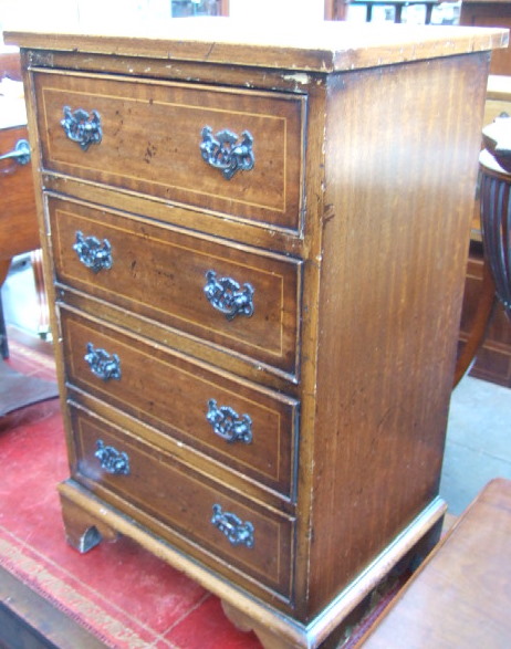 Appraisal: A th century inlaid mahogany small chest of four long