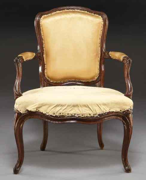 Appraisal: 'P Remy'' Louis XV carved walnut fauteuilwith padded back and