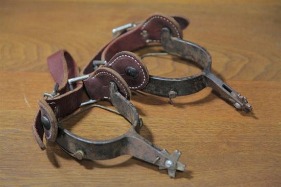 Appraisal: PAIR OF SIGNED SPURS With red leather straps and stamped