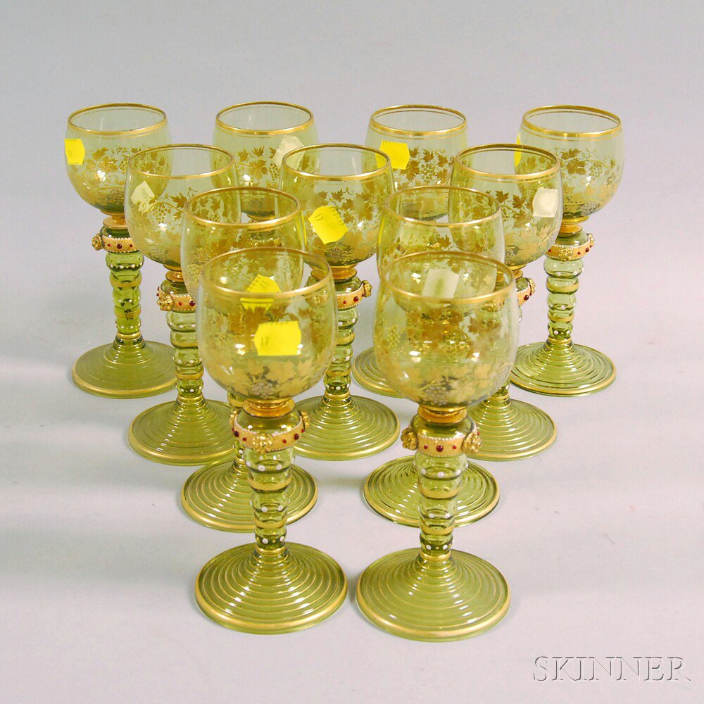 Appraisal: Set of Eleven Colored Glass Wines with gilt trim and