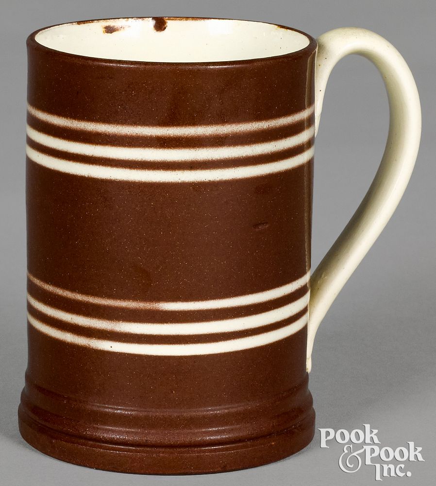 Appraisal: Mocha mug with brown and ivory bands Mocha mug with