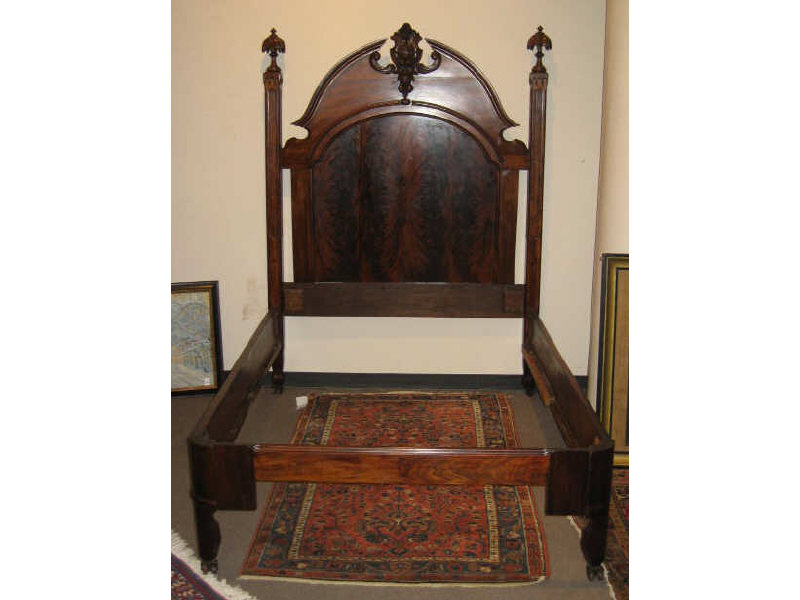 Appraisal: AMERICAN ROCOCO REVIVAL MAHOGANY BEDSTEAD The arched headboard with carved