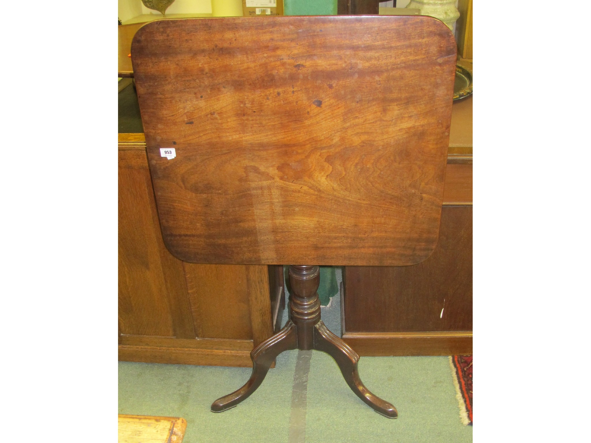 Appraisal: A Victorian mahogany snap-top table on a tripod base