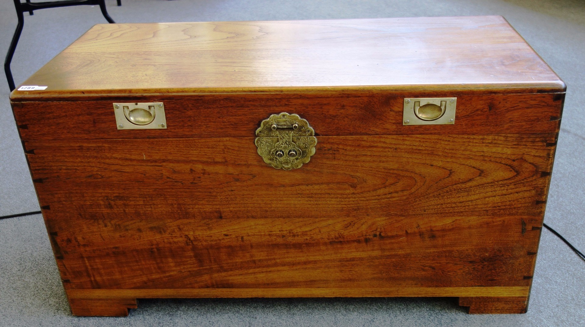 Appraisal: An early th century brass mounted rectangular camphorwood trunk on