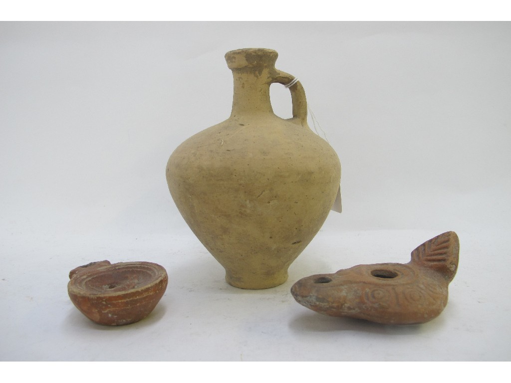 Appraisal: Two Roman pottery oil lamps and a flask