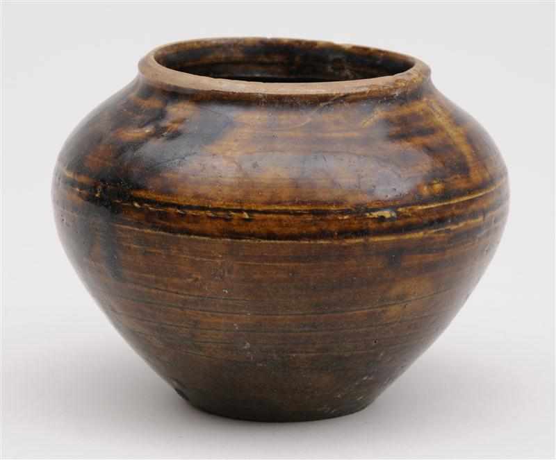 Appraisal: SAWANKHALOK BROWN-GLAZED POTTERY JAR With tapered ringed sides and sloping