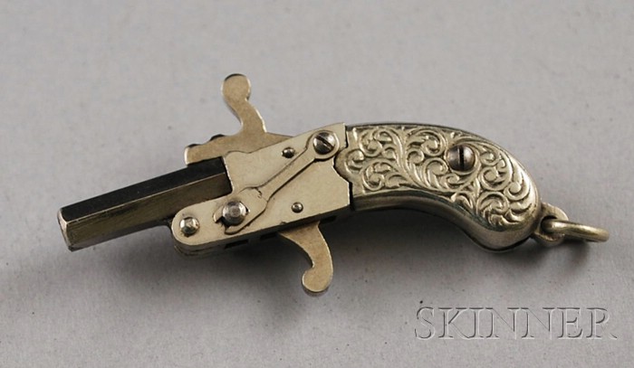 Appraisal: Small Austrian Silver and Silver Plated Mechanical Pistol Charm lg