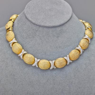 Appraisal: TEXTURED K GOLD DIAMOND COLLAR Oval ribbed links join X-shaped