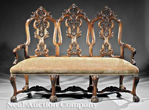 Appraisal: An Antique Portuguese Rococo-Style Carved Walnut Triple-Back Settee foliate carved