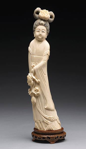 Appraisal: A carved ivory meiren th Century Dressed in a long