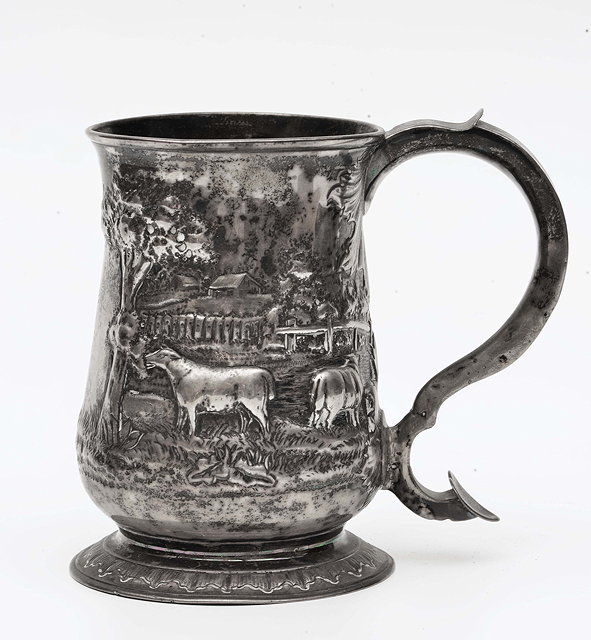 Appraisal: A GEORGE III SILVER BALUSTER TANKARD with scroll handle and