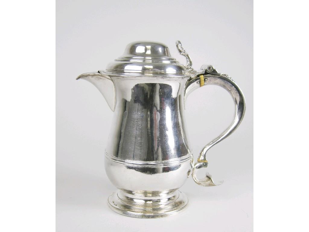 Appraisal: A George III baluster Jug with domed lid scroll handle