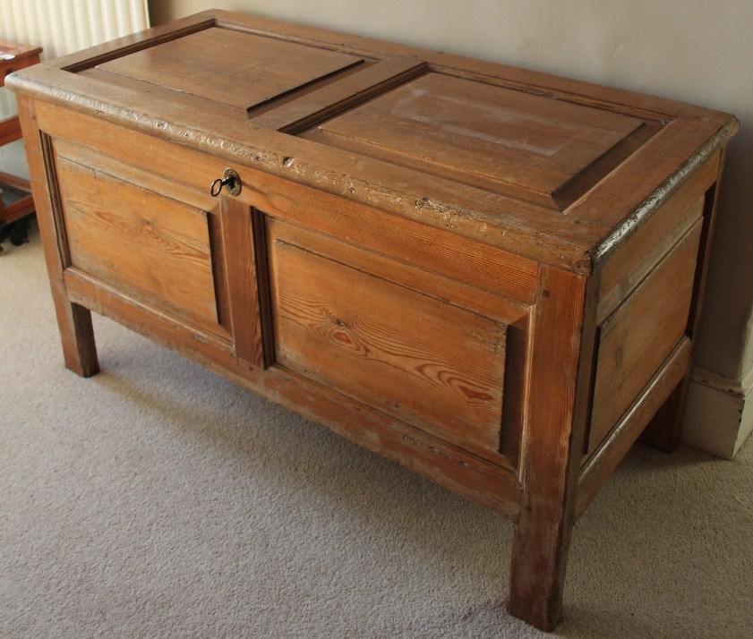 Appraisal: An thC style antique pitch pine blanket box with fielded