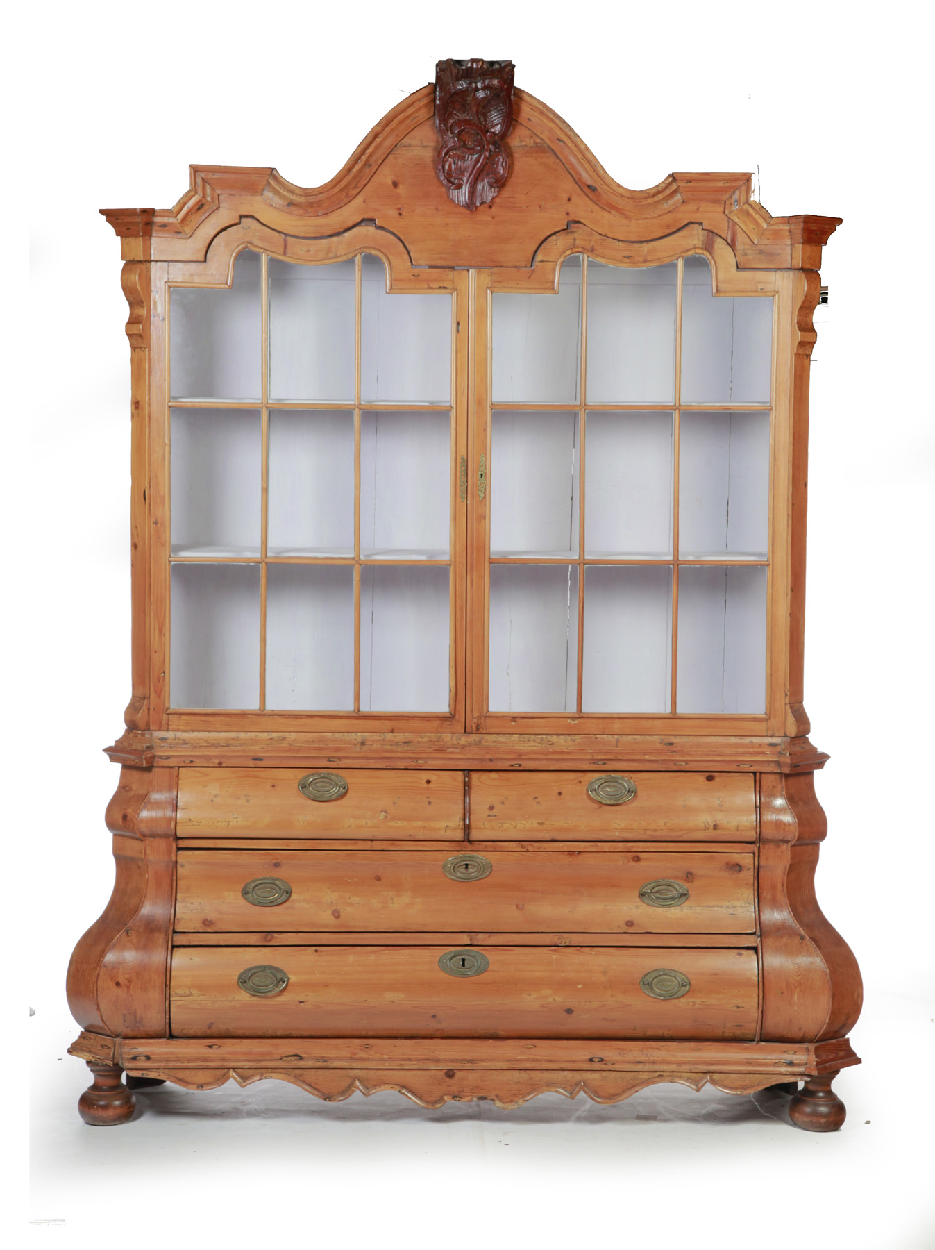 Appraisal: BAROQUE-STYLE TWO-PIECE CABINET European th century Pine Scalloped bonnet top