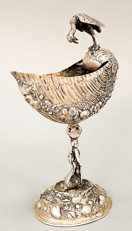 Appraisal: Continental silver neptune shell with northwind face mounted with bird