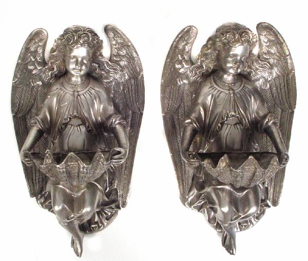 Appraisal: A pair of silvered bronze angel wall brackets with shell