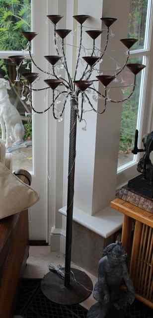 Appraisal: A PAIR OF WROUGHT IRON FIFTEEN LIGHT FLOOR STANDING CANDELABRA