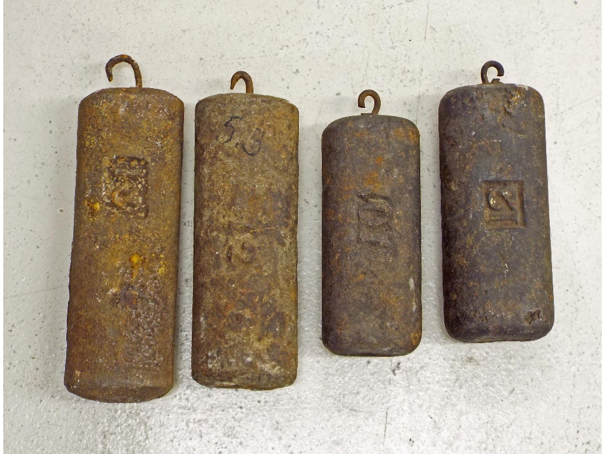 Appraisal: Four flat iron longcase clock weights