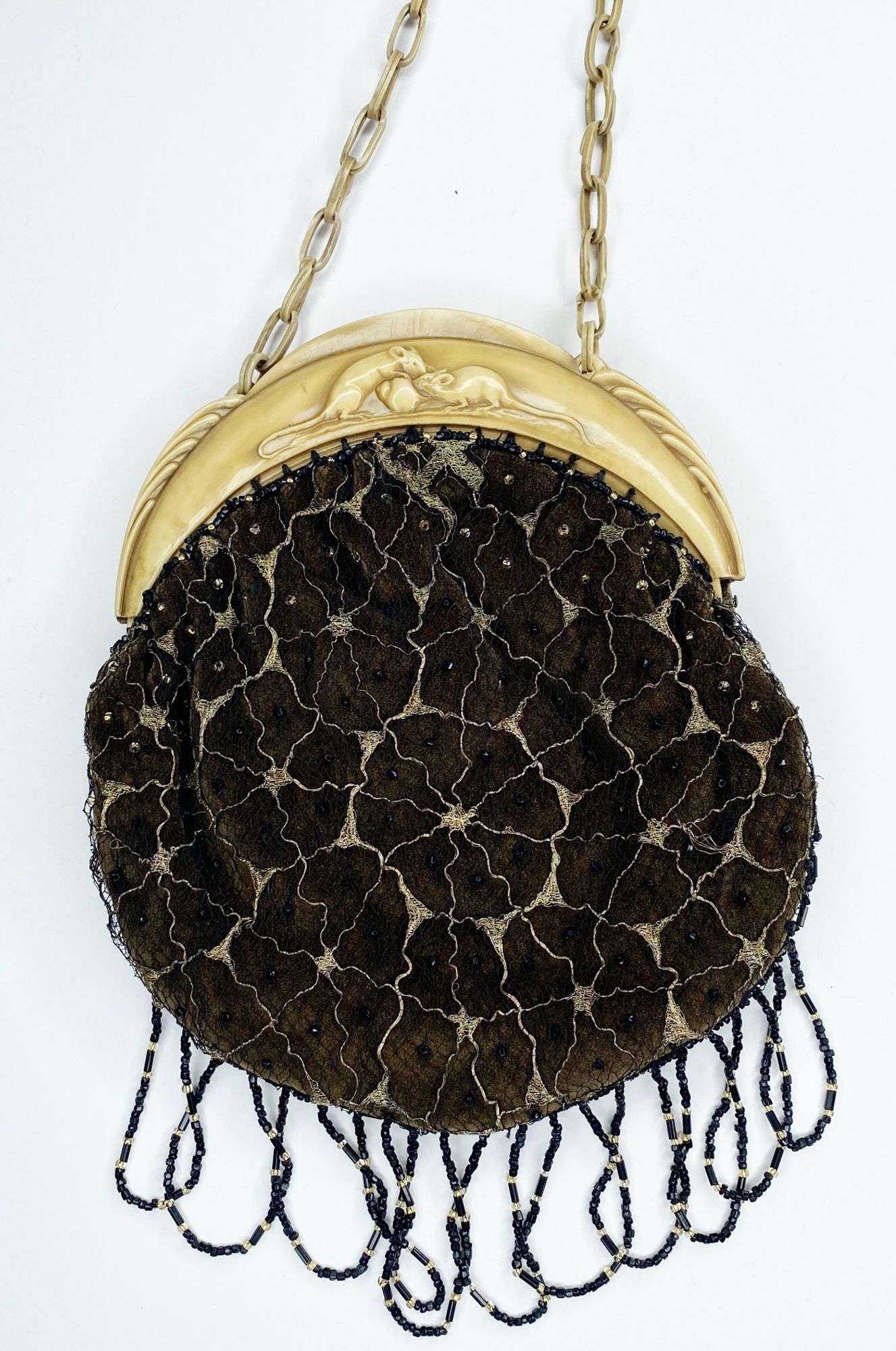 Appraisal: Beaded Spider Web Hand Bag with Celluloid Mice Frame long