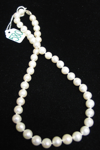 Appraisal: PEARL AND FOURTEEN KARAT WHITE GOLD NECKLACE strung with slightly