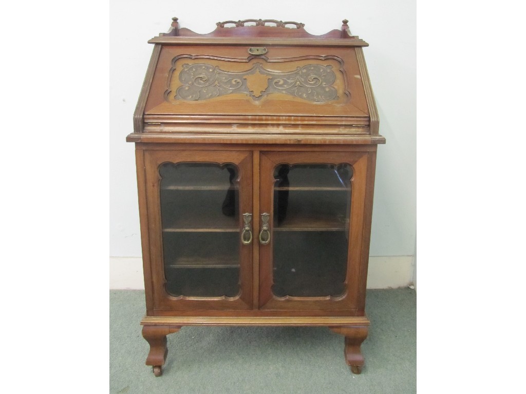 Appraisal: Edwardian mahogany Thomsons Patent writing bureau the drop flap bearing