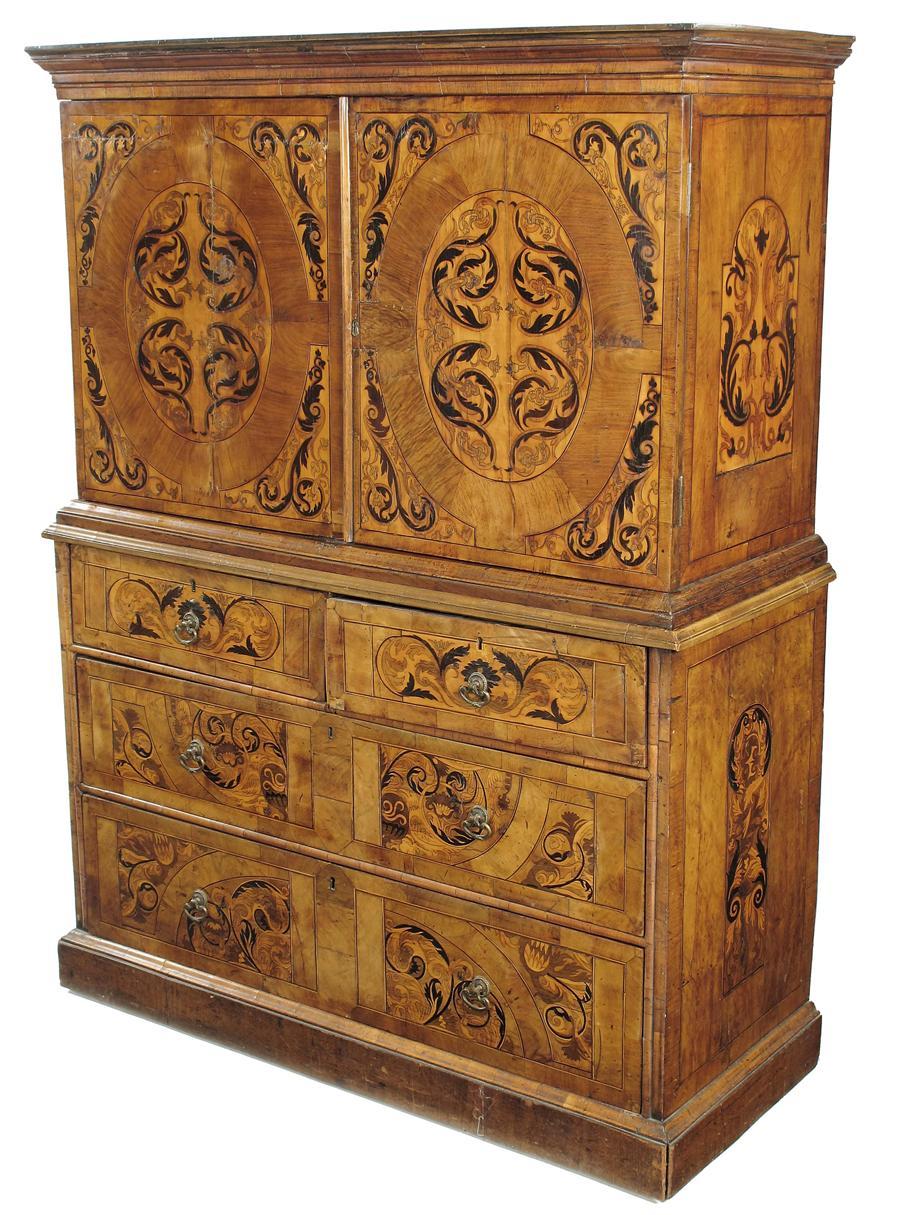 Appraisal: A Dutch walnut and marquetry cabinet on chest