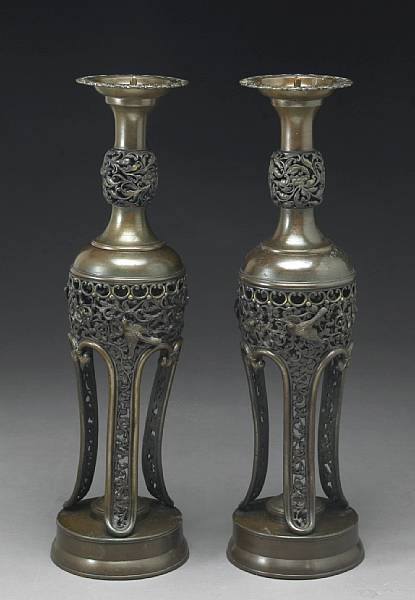 Appraisal: A pair of tall bronze candle prickets Meiji Period Each