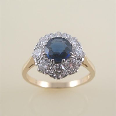 Appraisal: A sapphire and diamond cluster ring the circular cut sapphire