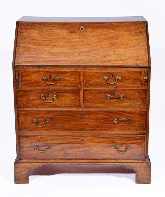 Appraisal: A GEORGE III MAHOGANY BUREAU with fitted interior fall front