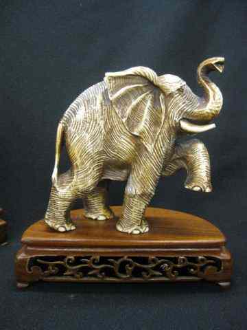 Appraisal: Pair of Carved Ivory Figurines of Elephants '' tall plus