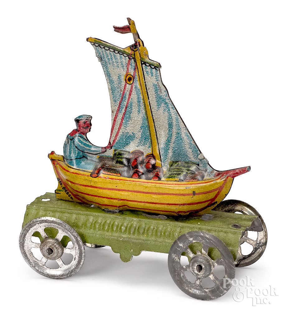 Appraisal: Meier tin lithograph man in sailboat penny toy Meier tin