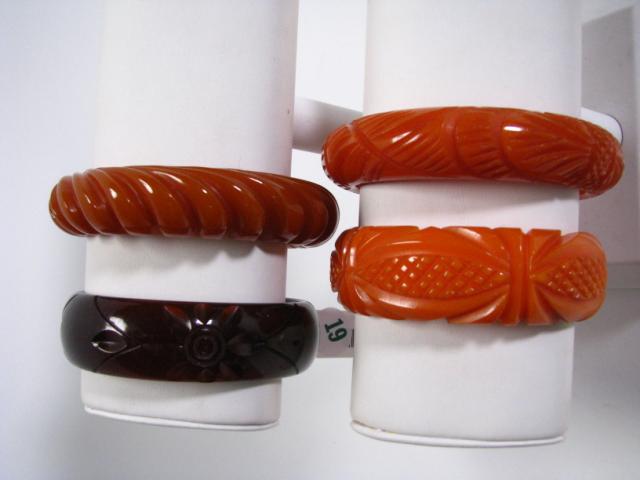 Appraisal: Four vintage carved bakelite bangle bracelets all in excellent condition