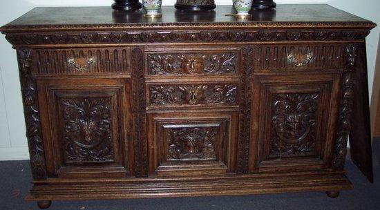 Appraisal: A Jacobean revival carved oak dresser fitted an arrangement of