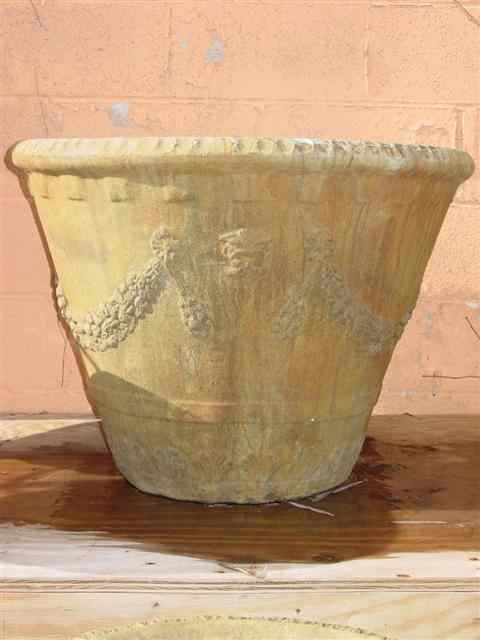 Appraisal: CAST STONE SWAGGED PLANTER The flared vessel with molded swags