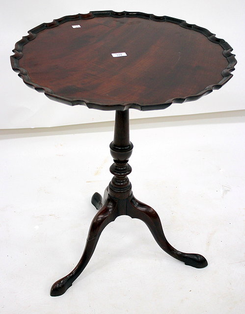 Appraisal: A GEORGE III MAHOGANY TRIPOD OCCASIONAL TABLE with shaped top