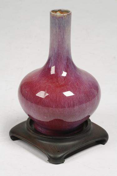 Appraisal: A CHINESE SANG DE BOEUF BOTTLE VASE with an unglazed