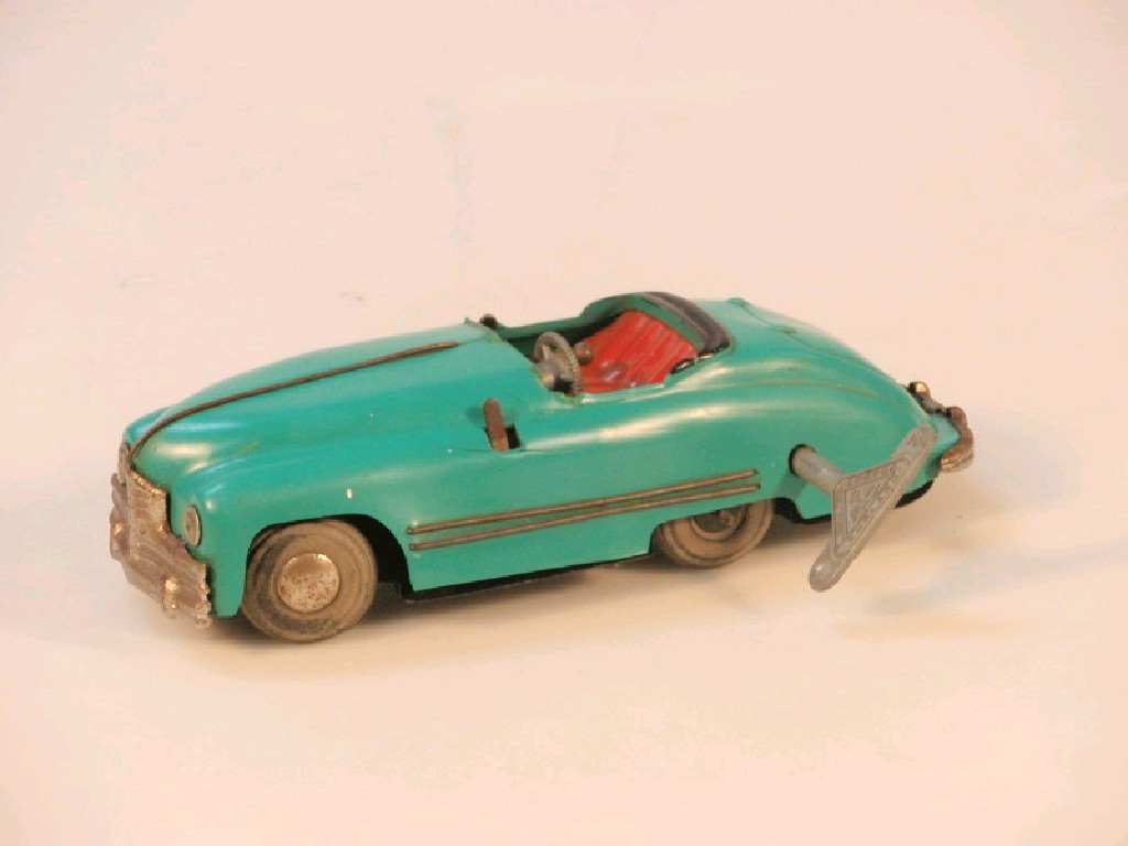 Appraisal: A Tri-ang Minic toys clockwork sports car with key