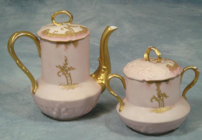 Appraisal: Limoges porcelain teapot and sugar bowl pink with gilt decoration