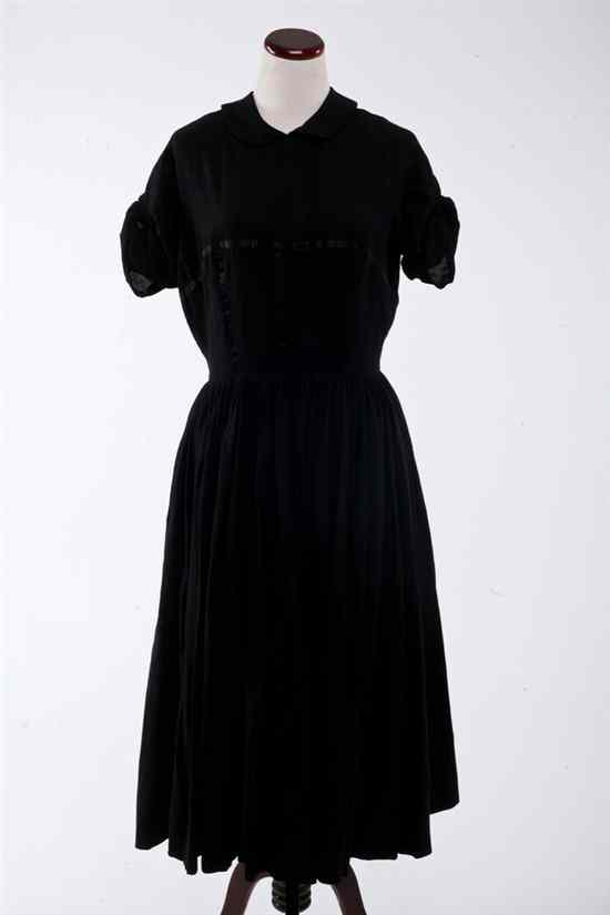 Appraisal: GALANOS BLACK WOOL DAY DRESS Short sleeved with peter pan