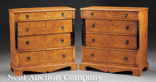 Appraisal: A Pair of Figured Maple and Ebonized Commodes stepped form