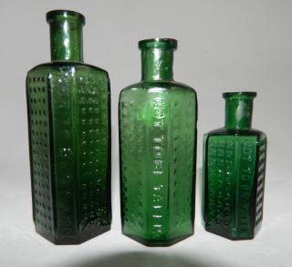 Appraisal: Poison Poison- green bottles- three panels plain side panels have