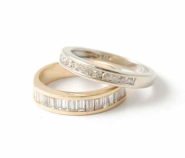 Appraisal: TWO DIAMOND RINGS K yellow gold with channel of baguette