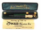 Appraisal: An early Swan fountain pen with yellow metal mounts chain