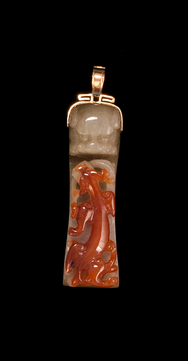 Appraisal: MUTTONFAT JADE GIRDLE HOOK With raised carved russet qilong design