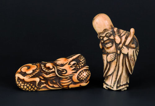 Appraisal: Two Japanese carved ivory netsuke th c to include Fukurokusu