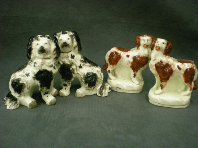 Appraisal: Pair of Red and White Dogs Standing With Large Red