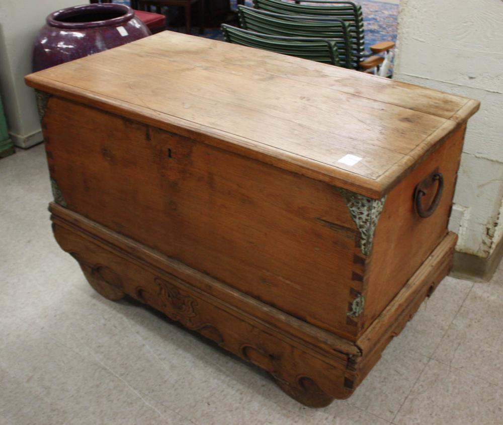 Appraisal: LIFT-TOP TEAK DOWRY CHEST ON WOOD WHEELS India th century