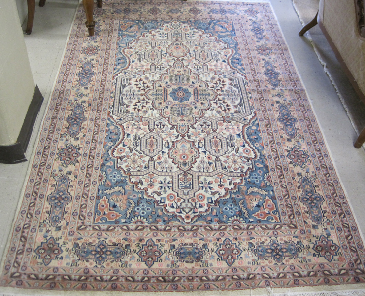 Appraisal: HAND KNOTTED ORIENTAL CARPET Indo-Persian floral and central floral medallion