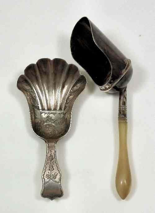 Appraisal: A Victorian silver caddy spoon with shaped and shell pattern